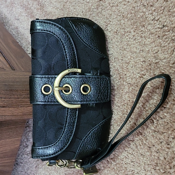 - Coach wristlet black super cute large enough for phone. - Picture 9 of 16